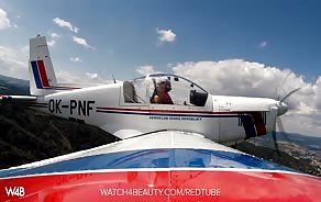 really hot babe with massive tits gets into an airplane and strips