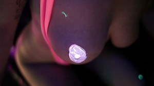 Hot lesbians playing with fluorescent body paint