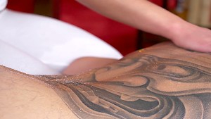 Bootilicious babe massages client's cock with her cunt