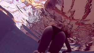 Lucy swimming in the pool