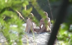 Couple gets caught on the beach having sex and then a third guy joins the scene...