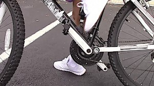 Cute Latina cycler learns to ride cock